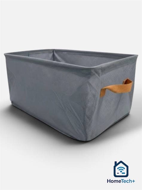 Canasto de tela gris con asas